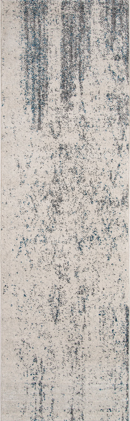 Ivory rug with blue-gray vertical streaks and an abstract distressed pattern; denim-inspired texture.