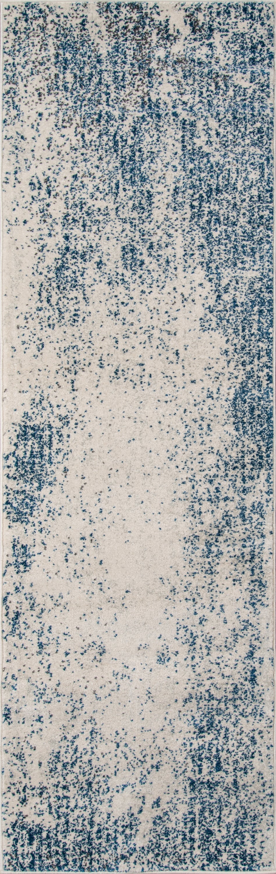 Rectangular blue and beige distressed rug with speckled pattern for contemporary living spaces.