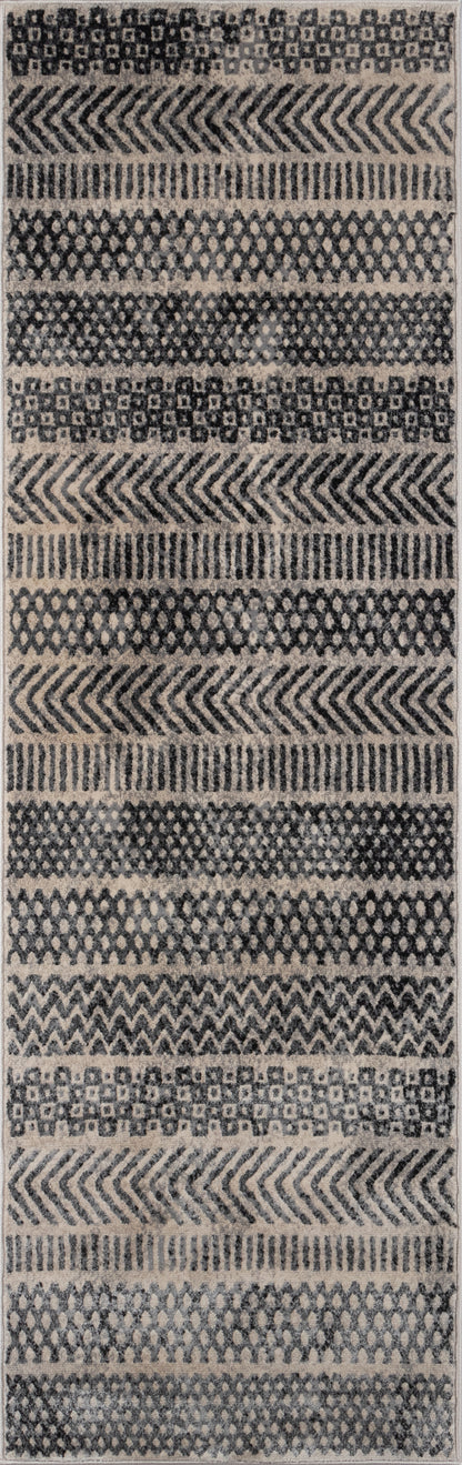 Gray geometric area rug (4' x 6') with repeating chevron, diamond and lattice bands in neutral tones; woven textile.