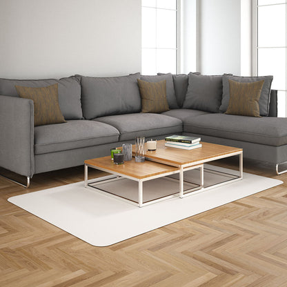 Gold twist basketweave fabric texture (NJ25-1995) seen in a modern living room with a grey sectional sofa, brown cushions, and two-tier light-wood coffee tables with white metal frames.