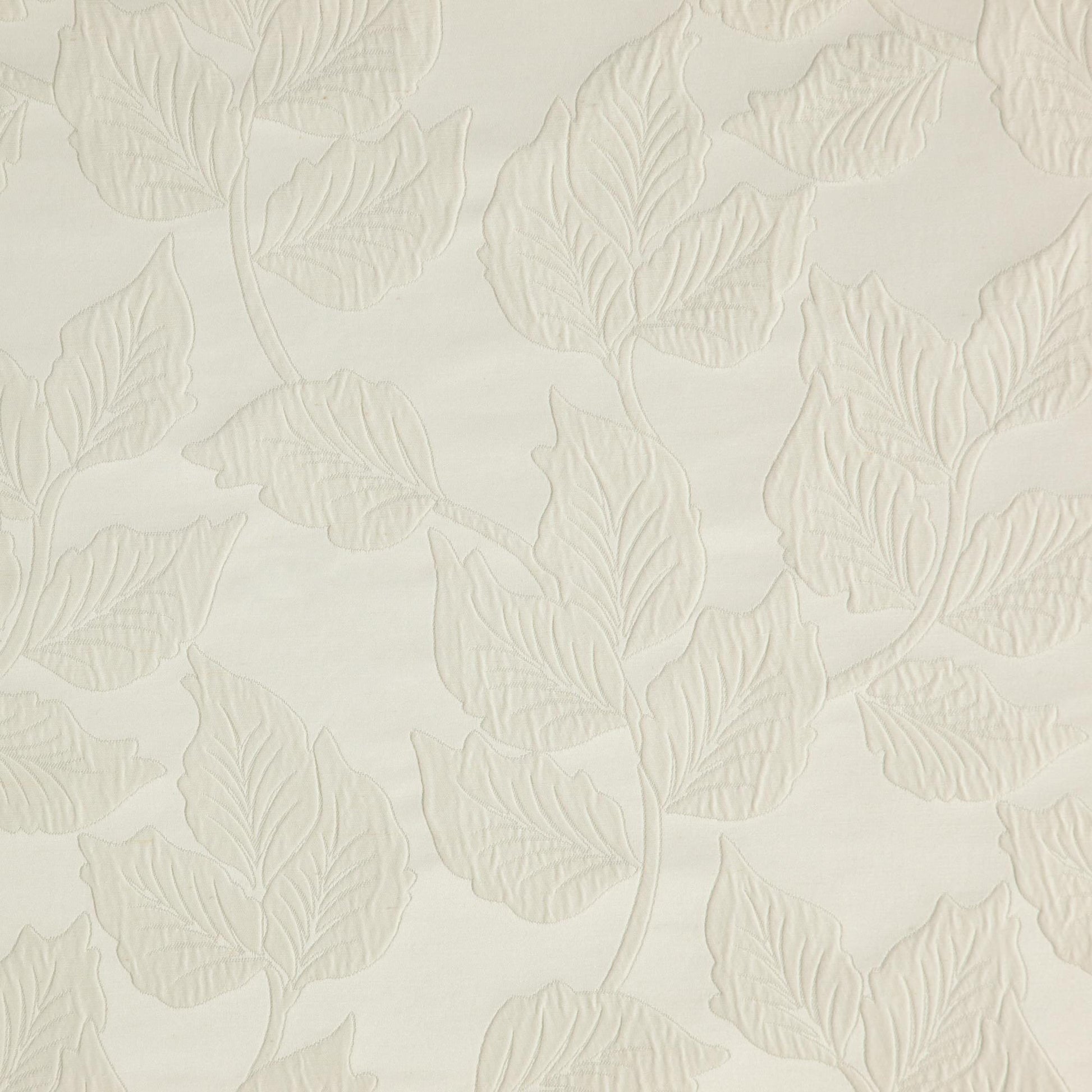 Cream embossed fabric with a raised leaf and vine botanical jacquard motif for a subtle textured look.