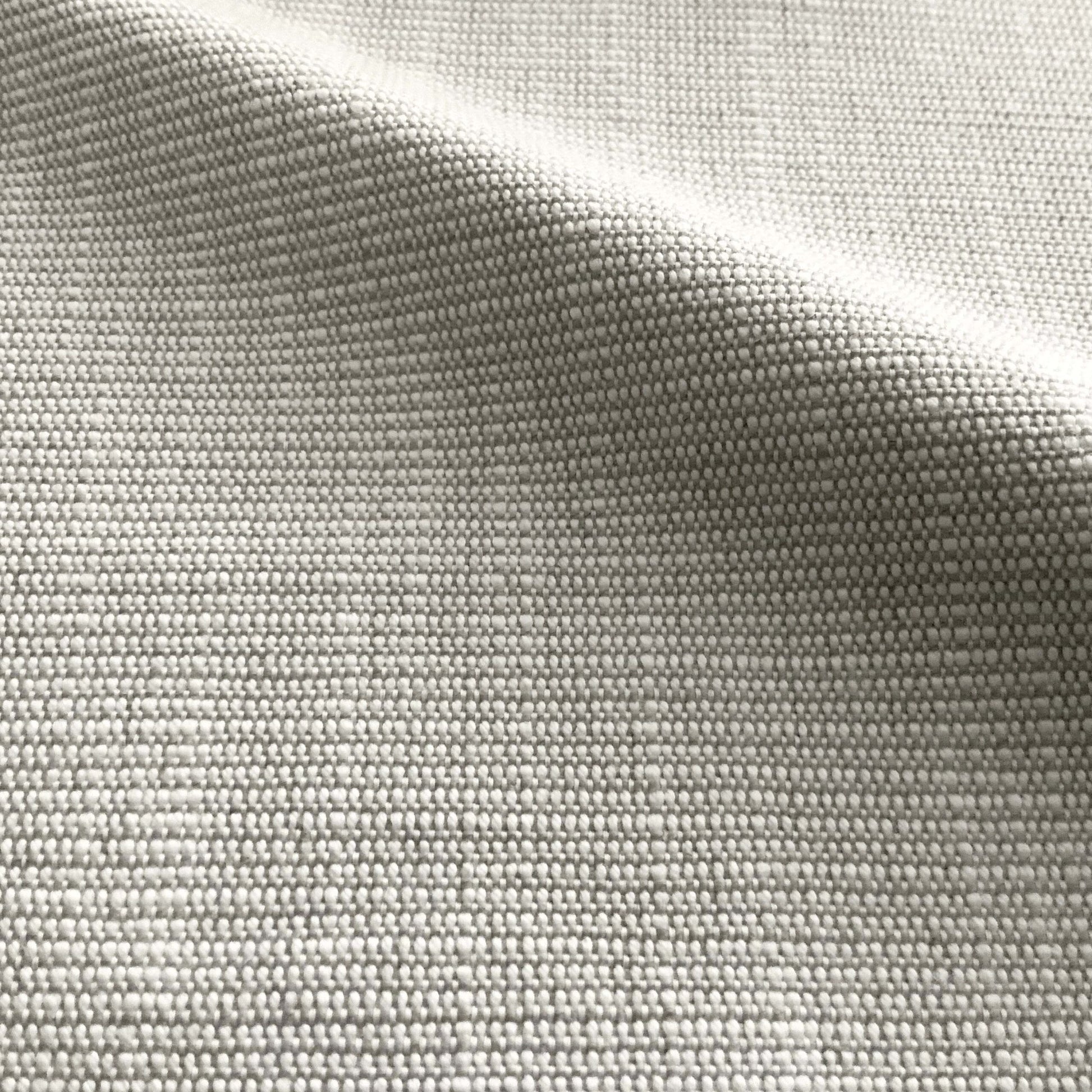 Close-up of light gray woven fabric with a subtle grid texture and soft drape.