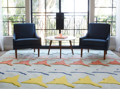 Geometric multicolor rug on the floor in a living room.