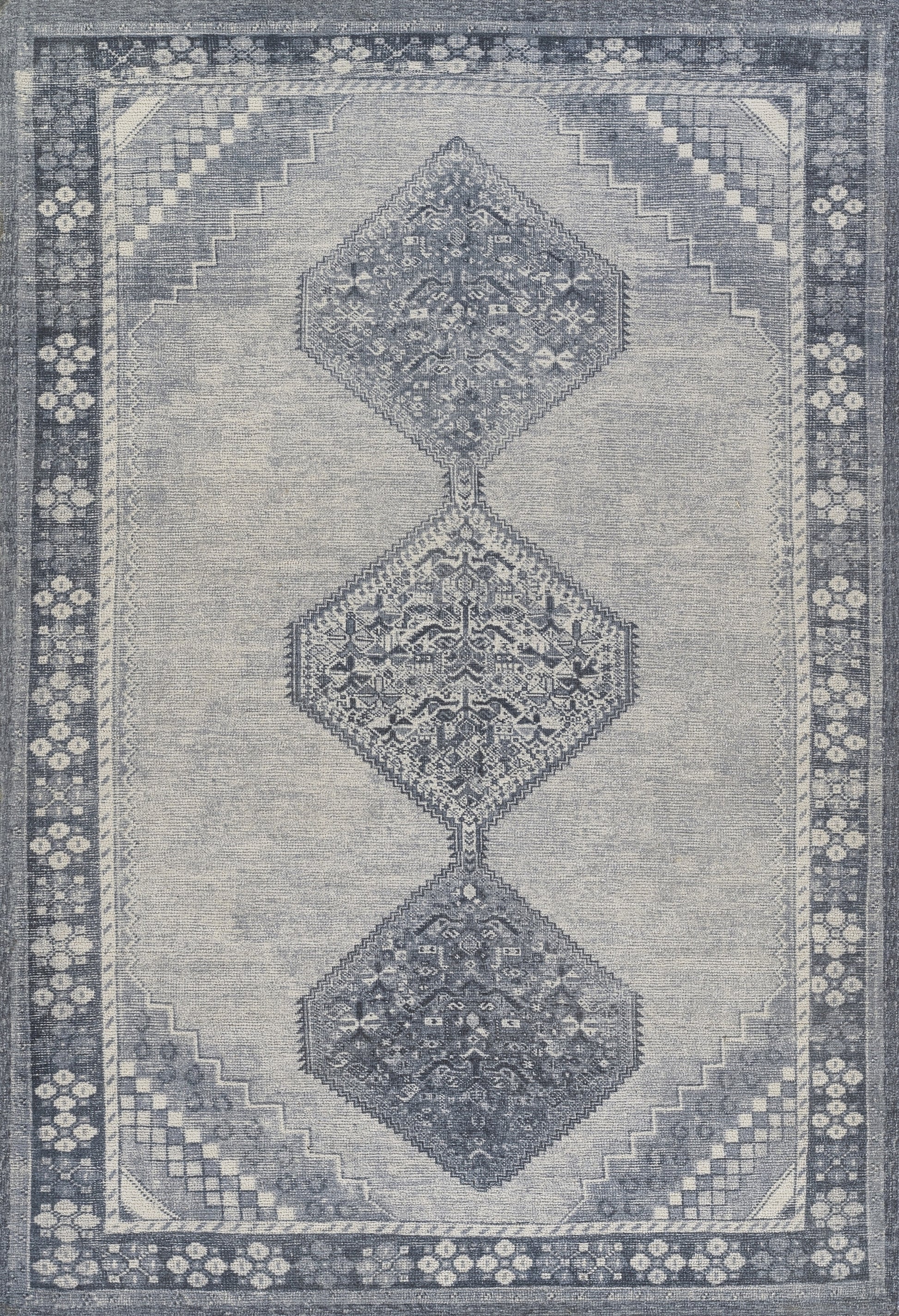 Blue-gray rug with three connected diamond medallions, floral motifs and a stepped border in a Persian-inspired design.