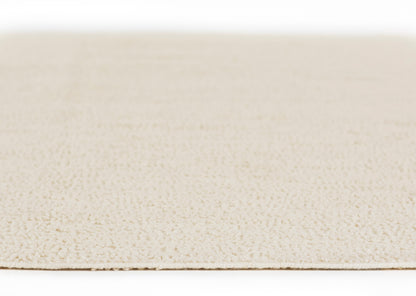 Beige ivory rug close-up showing soft loop pile texture for neutral living room decor.