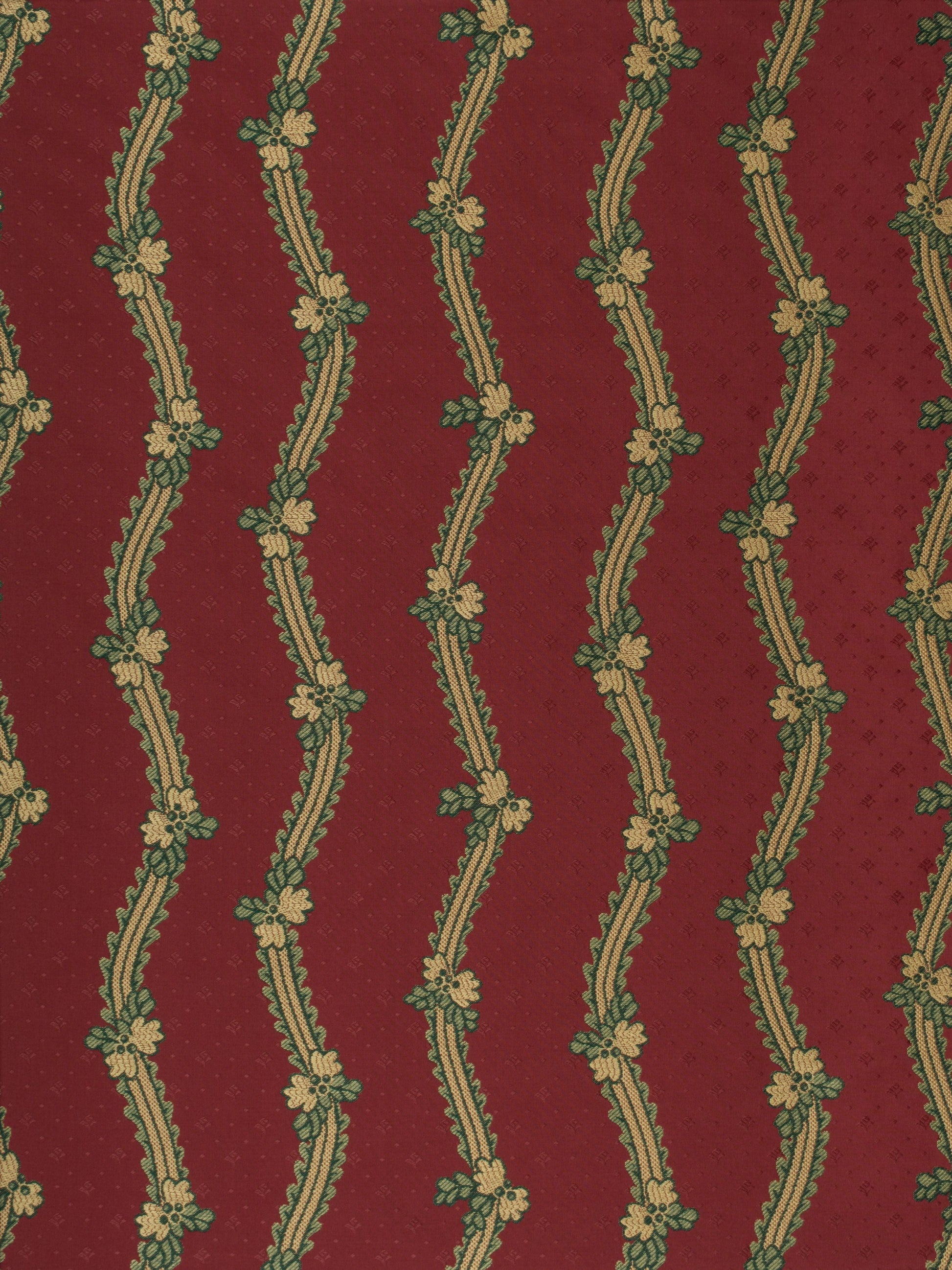 Maroon fabric with cream wavy vertical stripes entwined by green floral vines and small blossoms.