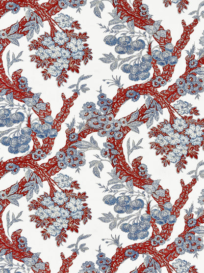 Red gnarled tree branches with blue blossoms and leaves on white background; decorative floral textile print