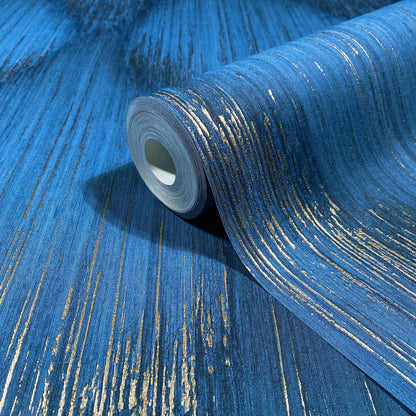 Blue textured wallpaper roll with metallic gold streaks, curled edge.