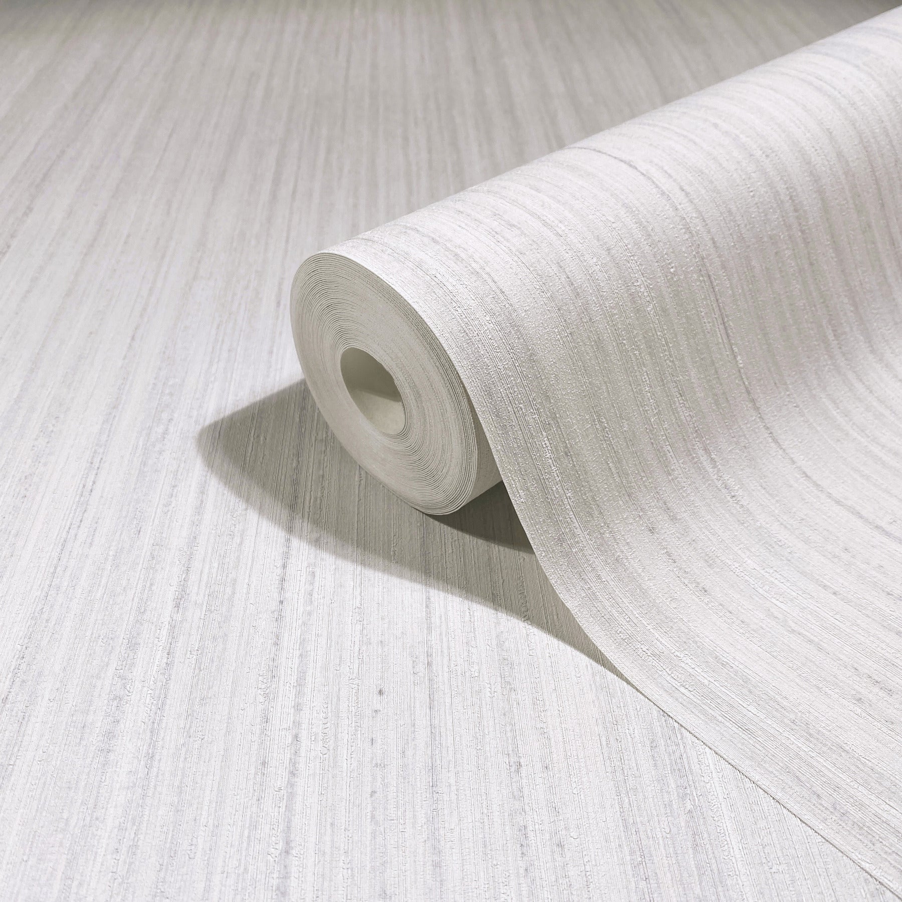 White textured wallpaper roll with subtle linen-like lines, ideal for walls and home decor.