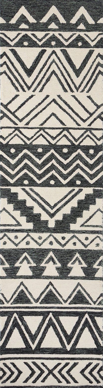 Black & white woven rug with zigzag, chevron and triangle geometric motifs in a bold tribal print.