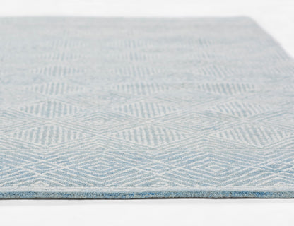 Blue and white geometric flat-weave rug with diamond/chevron pattern; rectangular, modern home decor.