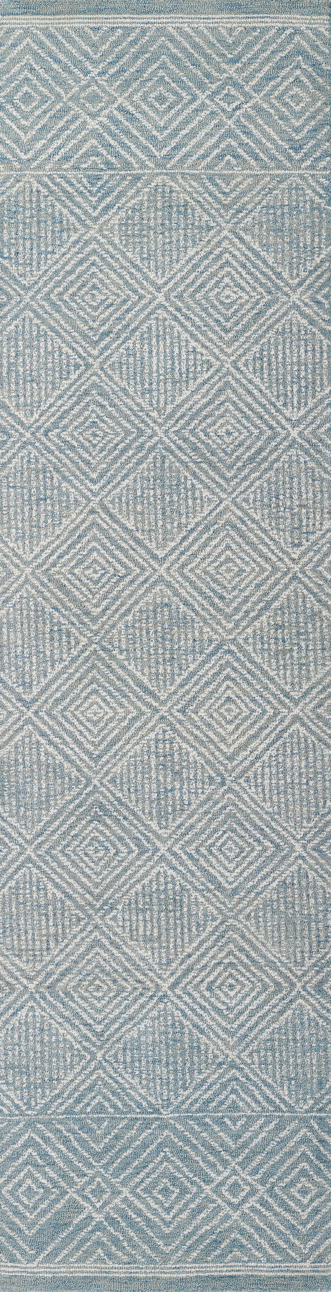 Blue woven rug featuring a white diamond lattice pattern and subtle geometric texture.