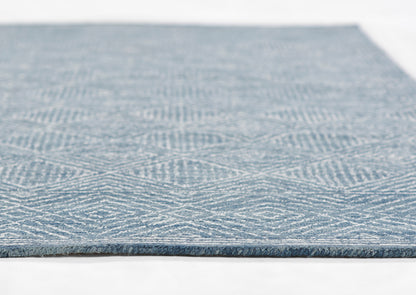Blue geometric-pattern rug with white lines, 3'6" x 5'6", close-up of textured weave and fringe edge.
