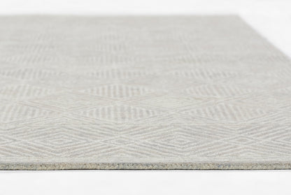 Gray geometric patterned rug with subtle chevron motif; rectangular, low-pile woven rug for living spaces.