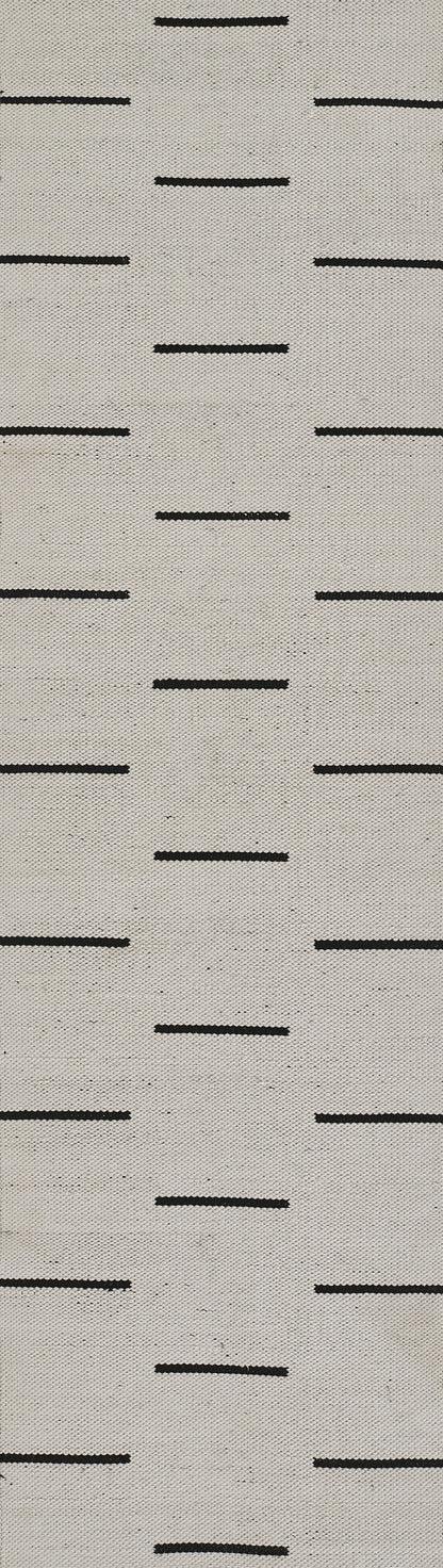 Beige woven fabric swatch with small black horizontal dash lines arranged in a subtle grid pattern.