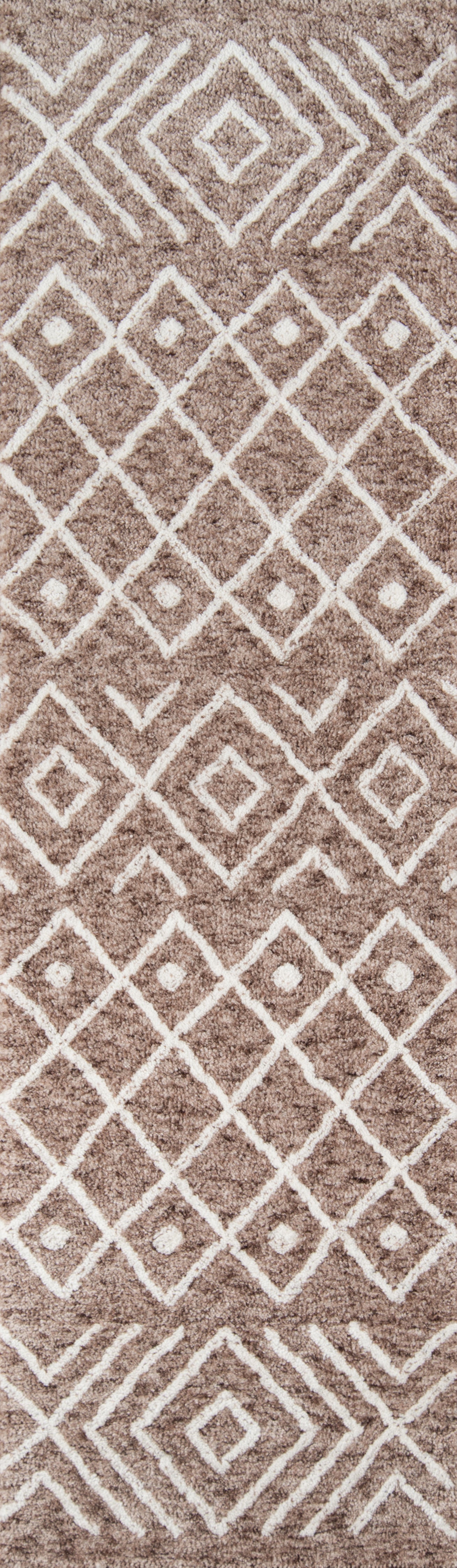 Taupe shag rug with white geometric diamond lattice pattern; plush, modern boho style.