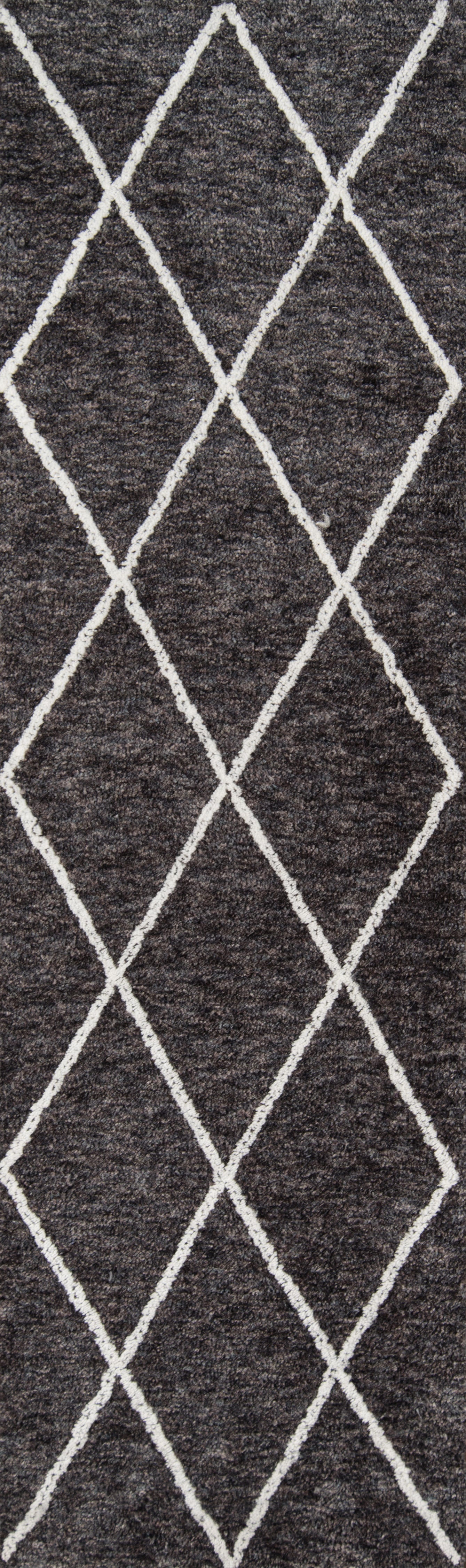 Charcoal shag rug with white diamond lattice pattern and plush textured pile.