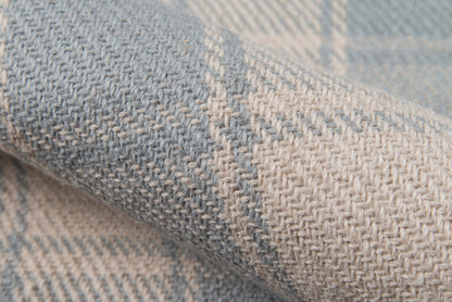Blue and beige herringbone wool-blend rug, close-up of the woven texture.