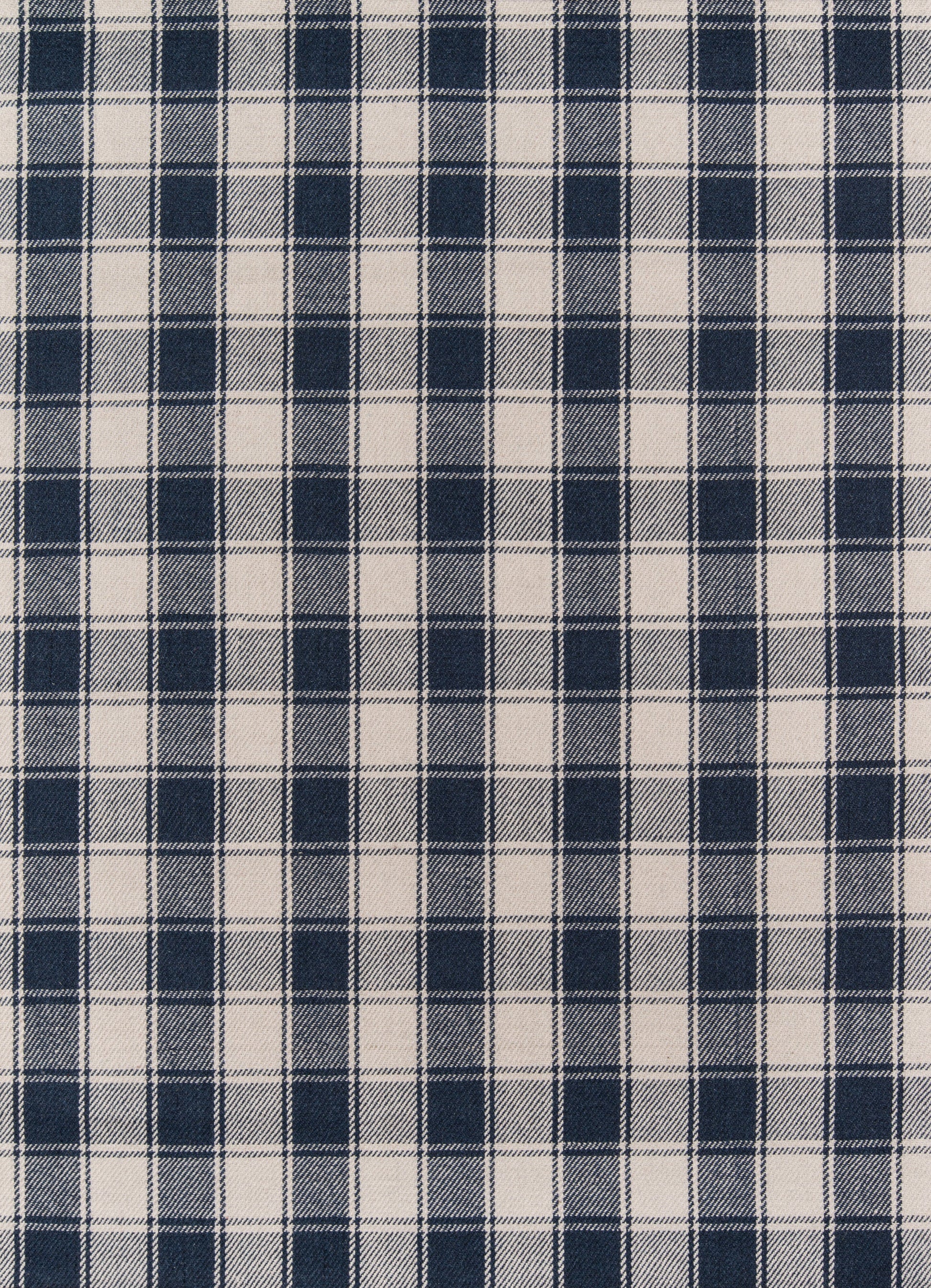 Navy blue and white plaid fabric with regular square checks in a gingham style, ideal for shirts or crafts.