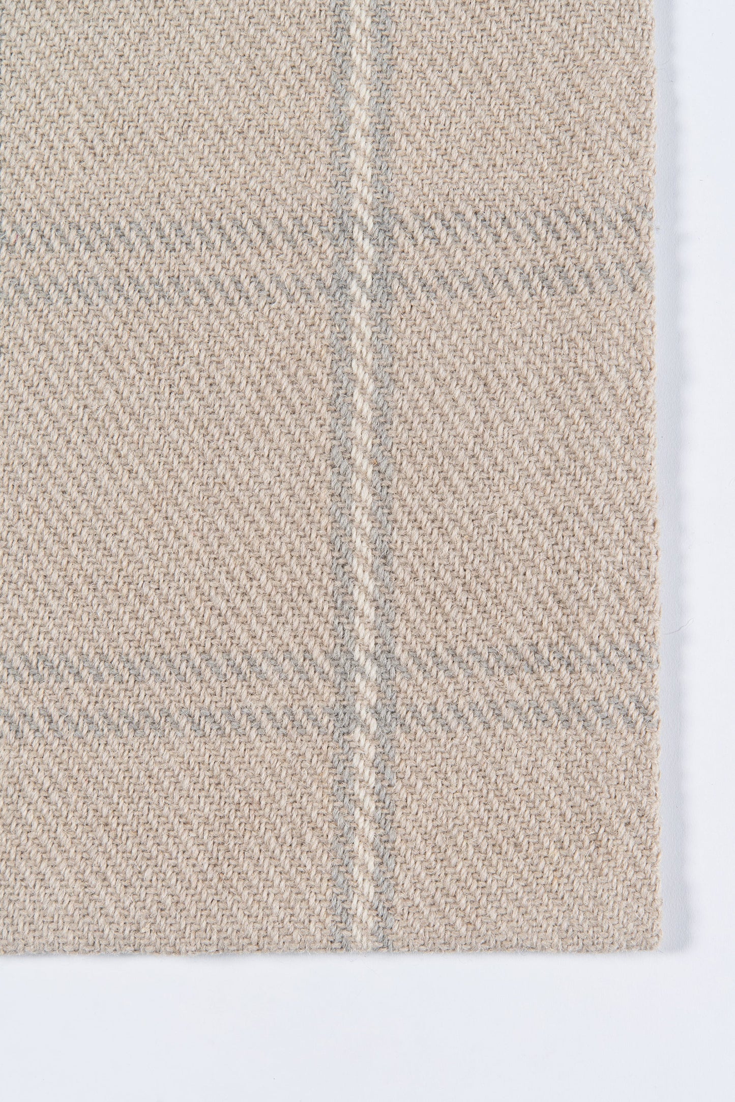 Beige woven rug runner with subtle gray plaid lines and diagonal twill texture, close-up.