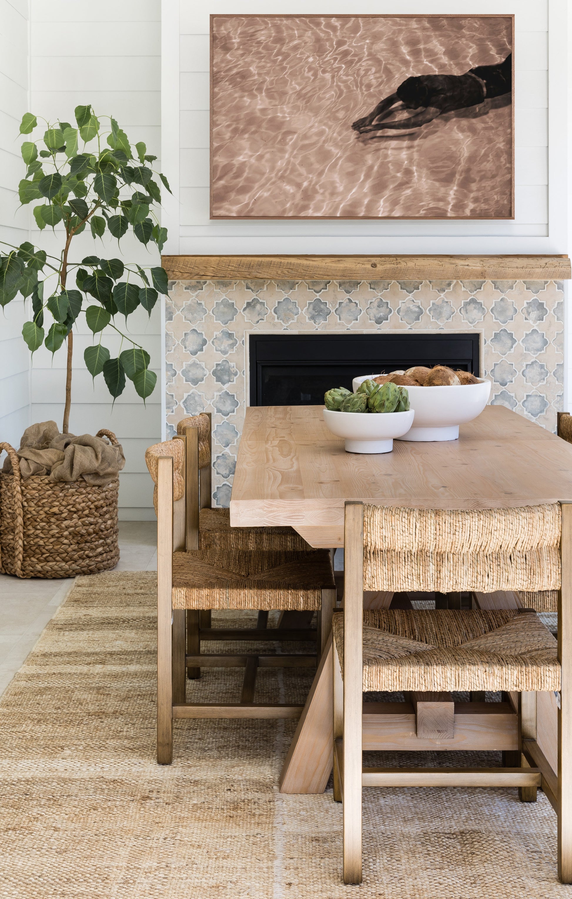6' x 9' rug on the floor under a dining set, showing woven texture in neutral tones.