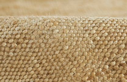 Close-up of natural jute & sisal woven mat texture in beige & tan tones.