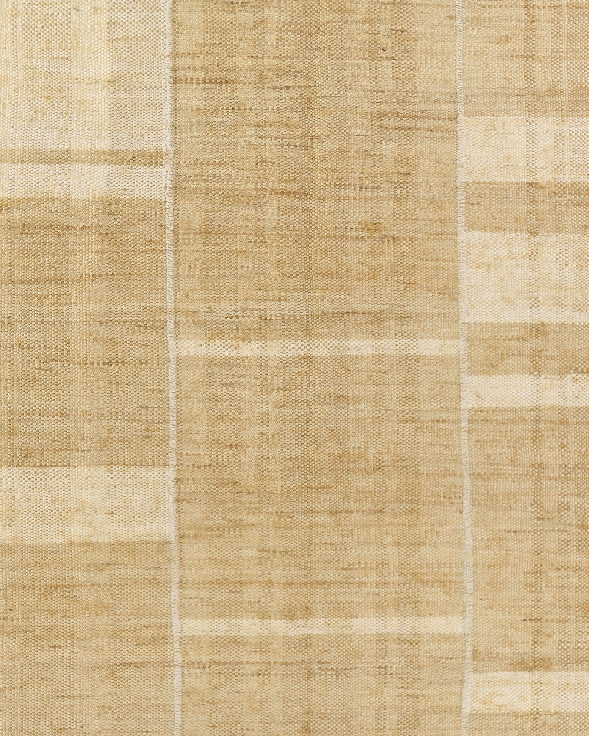 Natural beige patchwork rug with woven jute texture, rectangular, neutral rustic decor.