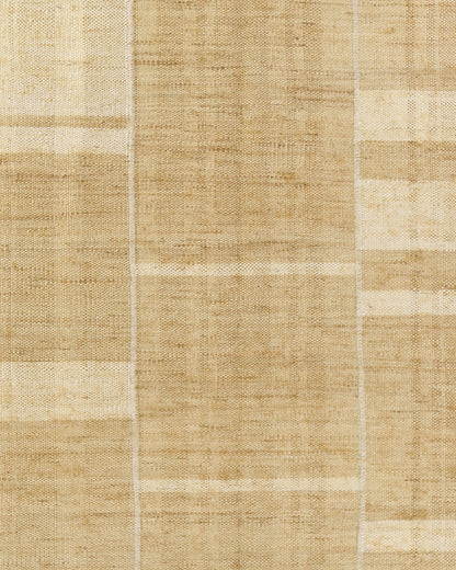 Natural beige patchwork rug with woven jute texture, rectangular, neutral rustic decor.