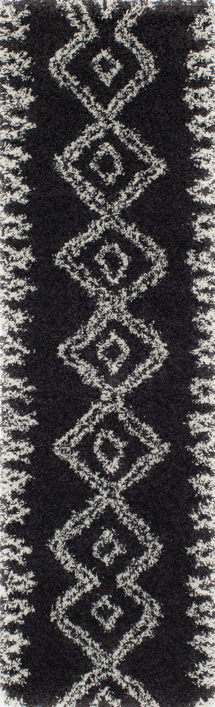 Black shag rug with white diamond geometric pattern running vertically along the center.