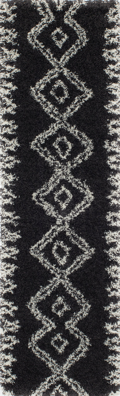 Black shag rug with white diamond geometric pattern running vertically along the center.