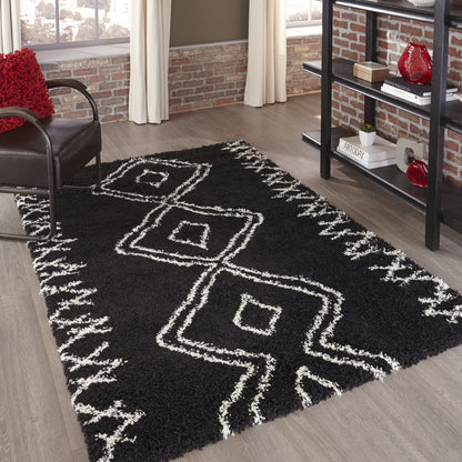 Black shag rug with white geometric diamond patterns in a modern living room.