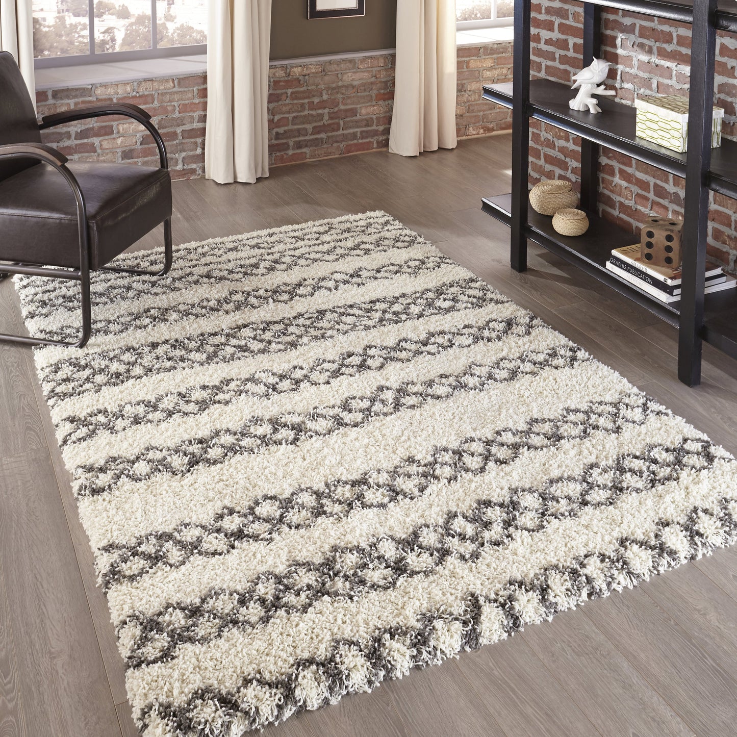 Cream shag rug with gray geometric stripe pattern, plush pile, rectangular area rug for a modern living room