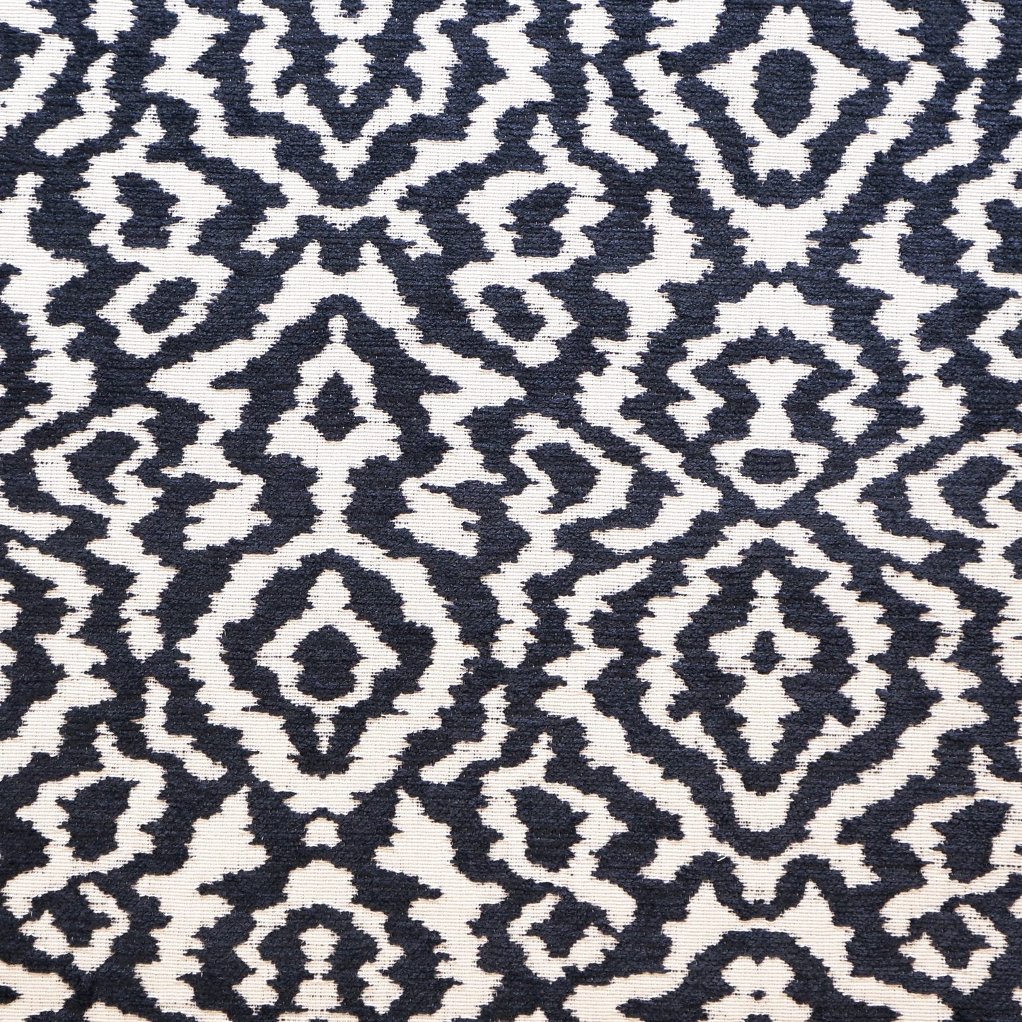 Navy and ivory woven fabric with a geometric pattern.