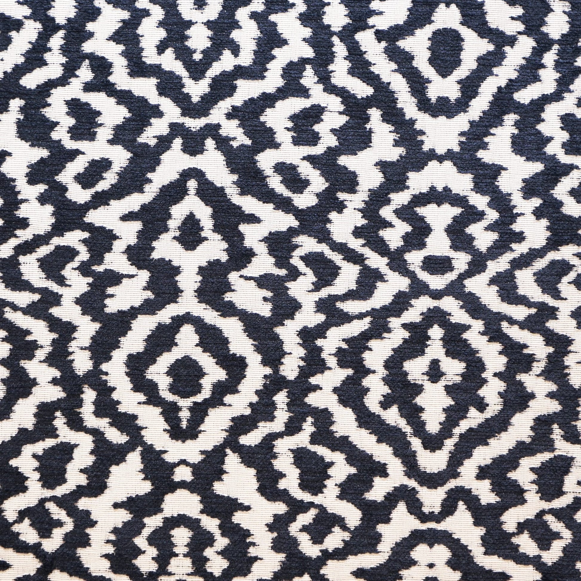 Navy and ivory woven fabric with a geometric pattern.