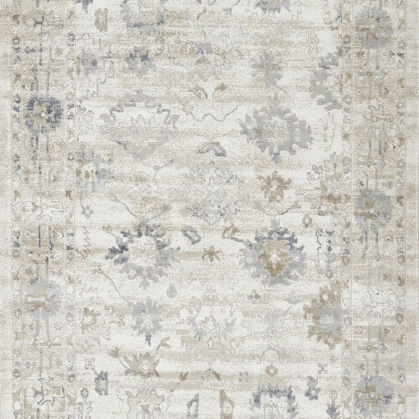 Rectangular distressed cream rug with pale blue-gray floral motifs and ornate border; vintage Persian-inspired.