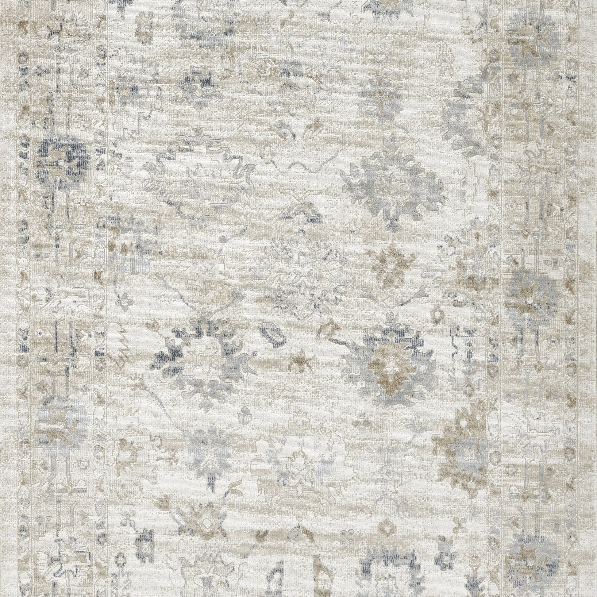 Rectangular distressed cream rug with pale blue-gray floral motifs and ornate border; vintage Persian-inspired.