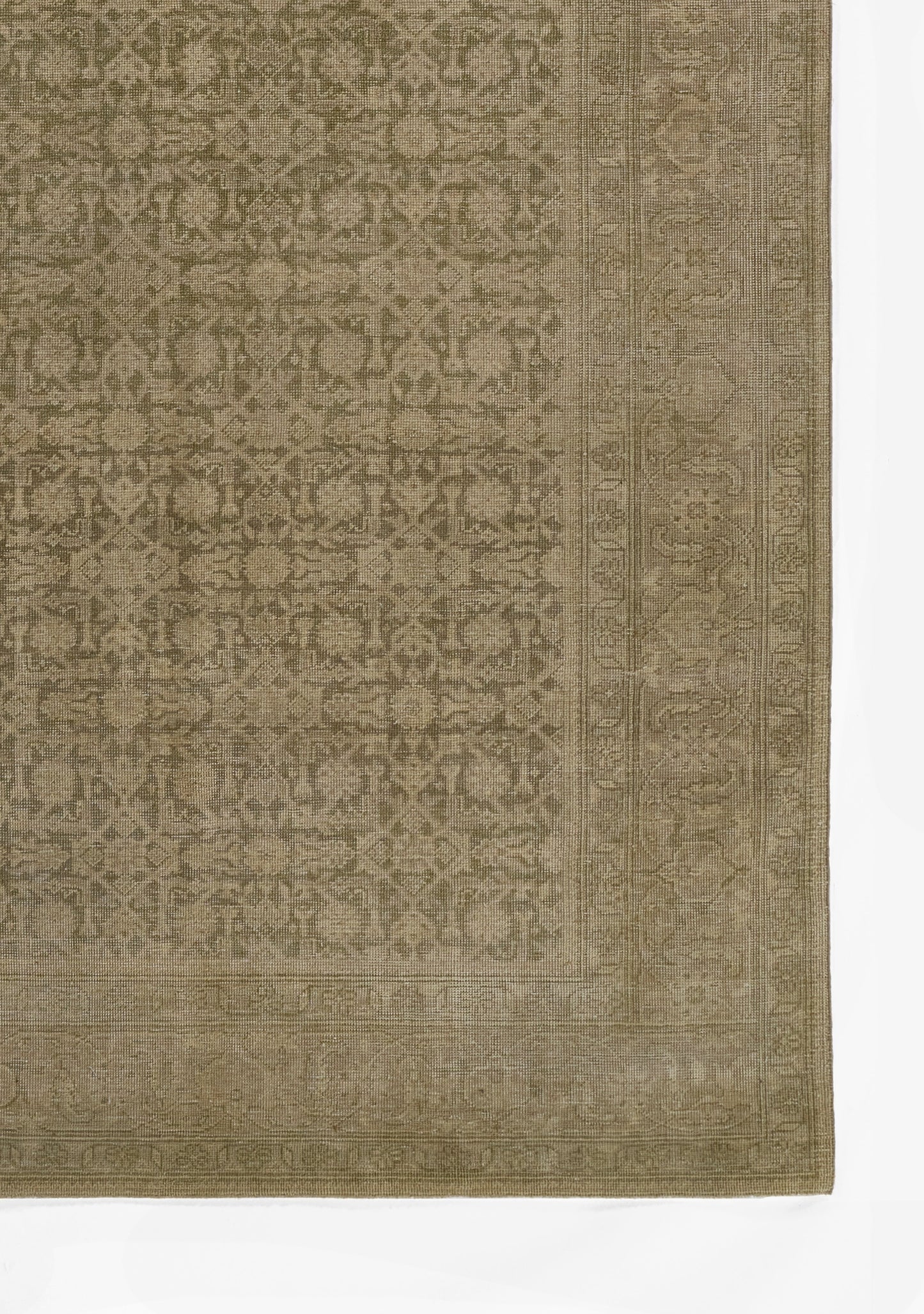 Rectangular tan-gold rug with intricate floral lattice pattern and ornate border; oriental-inspired decor.