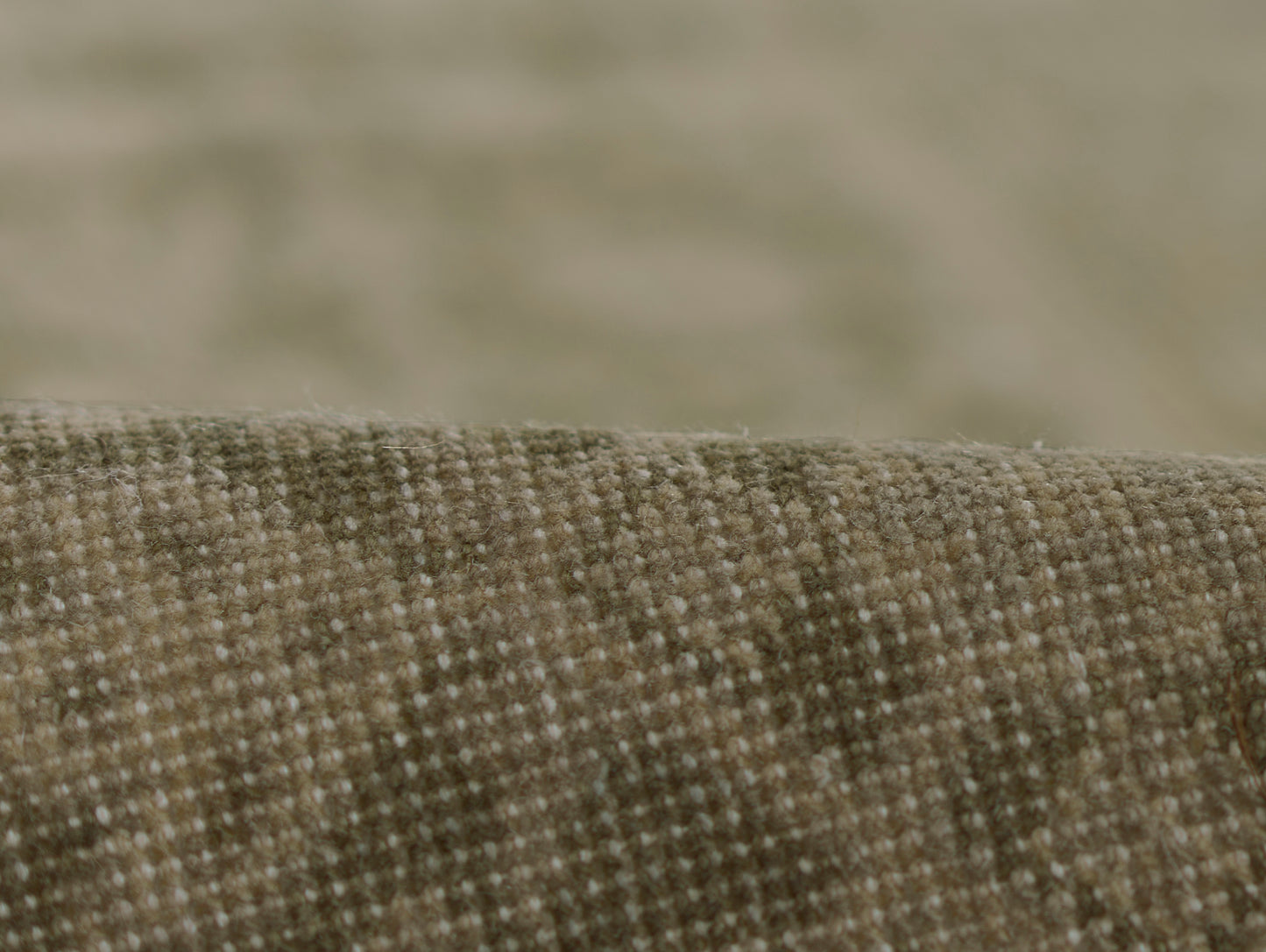 Brown tweed-style woven fabric close-up with tiny grid texture; upholstery material.