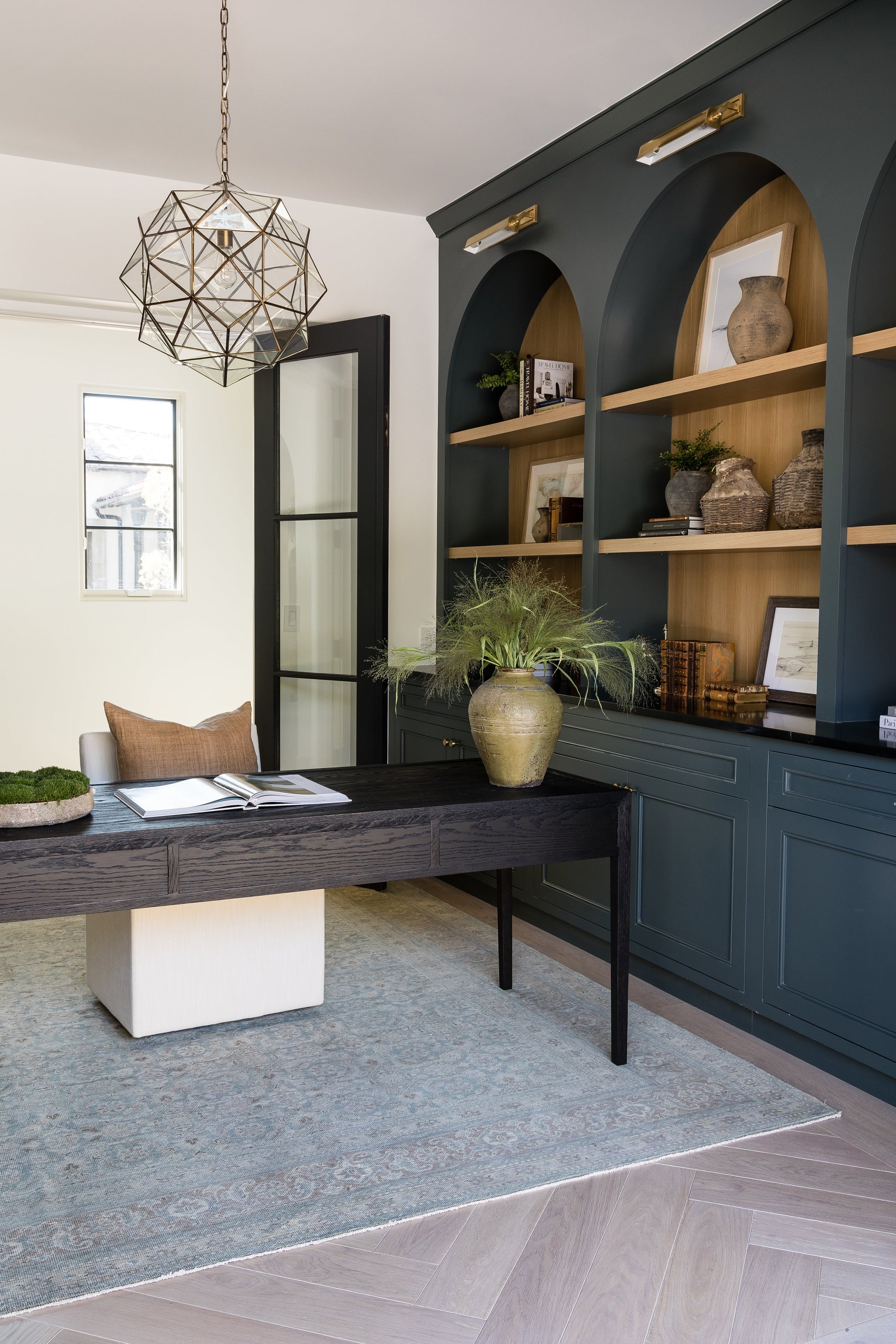 Dark teal rug runner, 2'6" x 9', shown in a room with a black desk, vase with greenery, and a geometric pendant light.