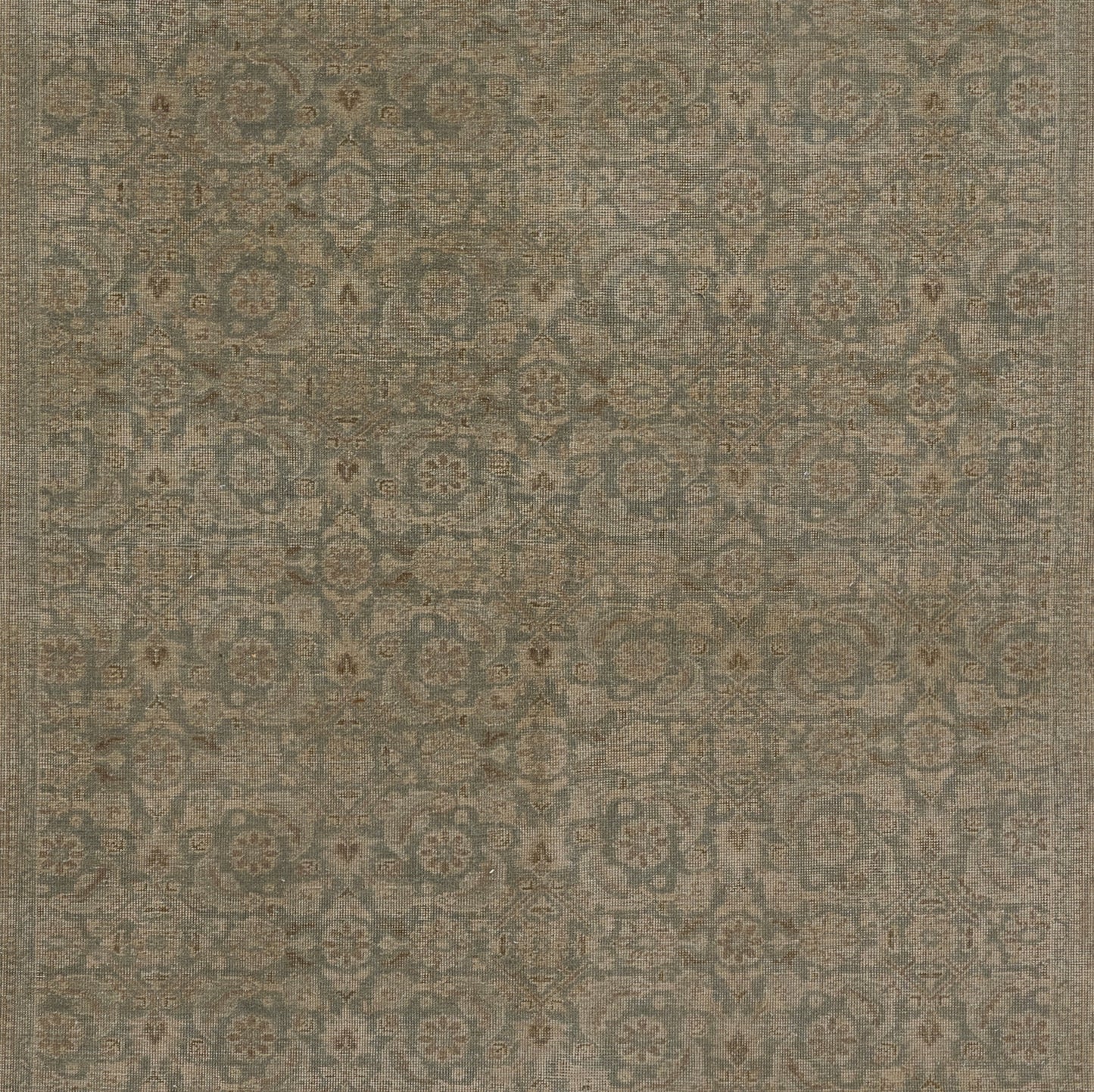 Blue-gray oriental rug with beige floral medallions and an ornate border.