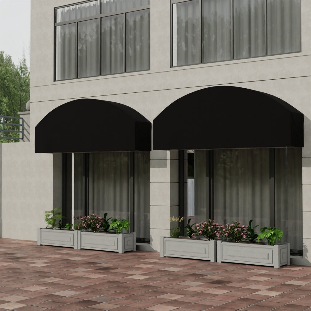Two black curved awnings over glass storefronts; planter boxes with green plants and pink flowers on a brick patio.