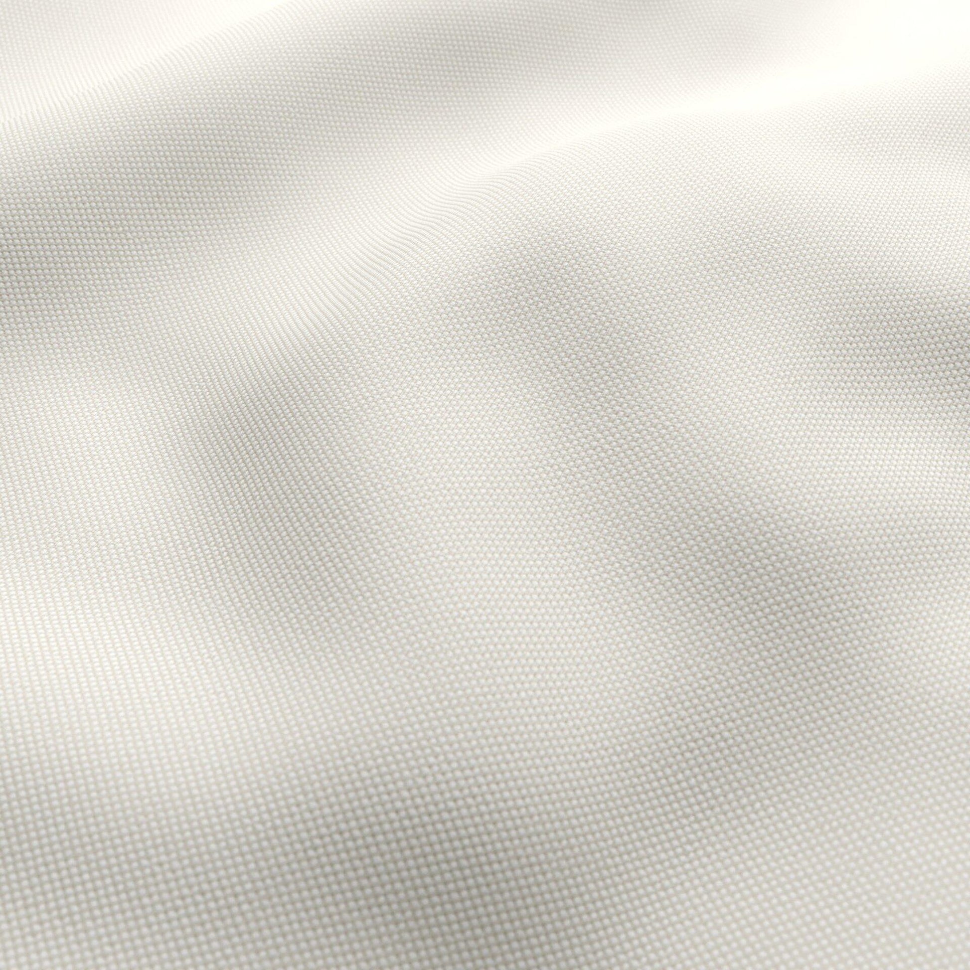 Ivory outdoor jacquard fabric with a subtle textured weave and soft drape.