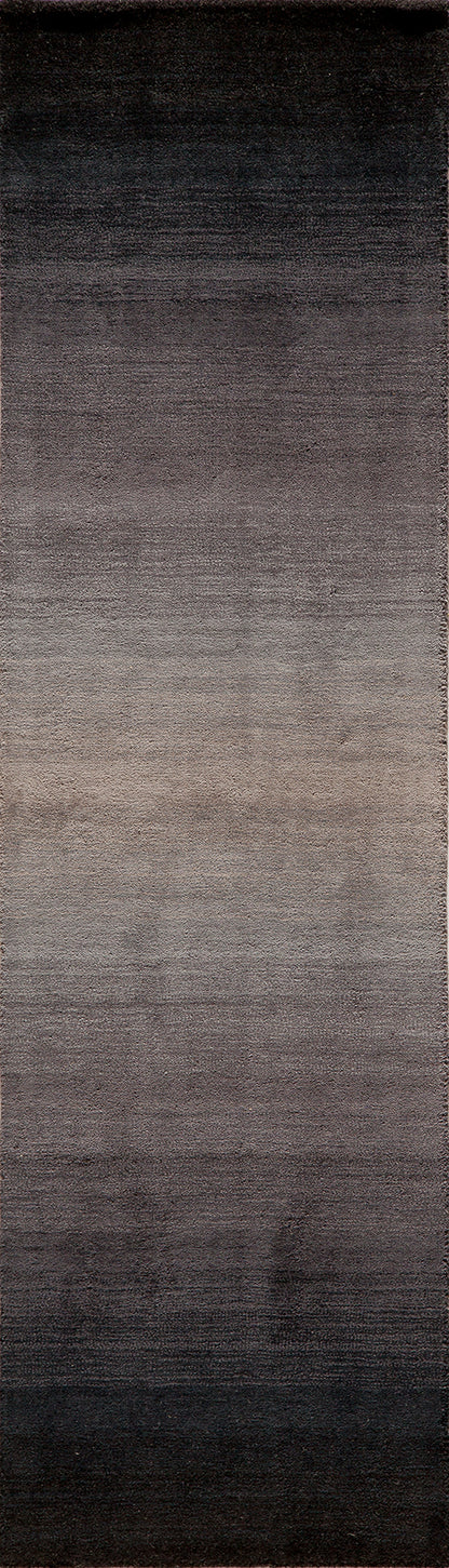 Gradient rectangular rug fading from black at the top to warm taupe at the bottom, plush texture.
