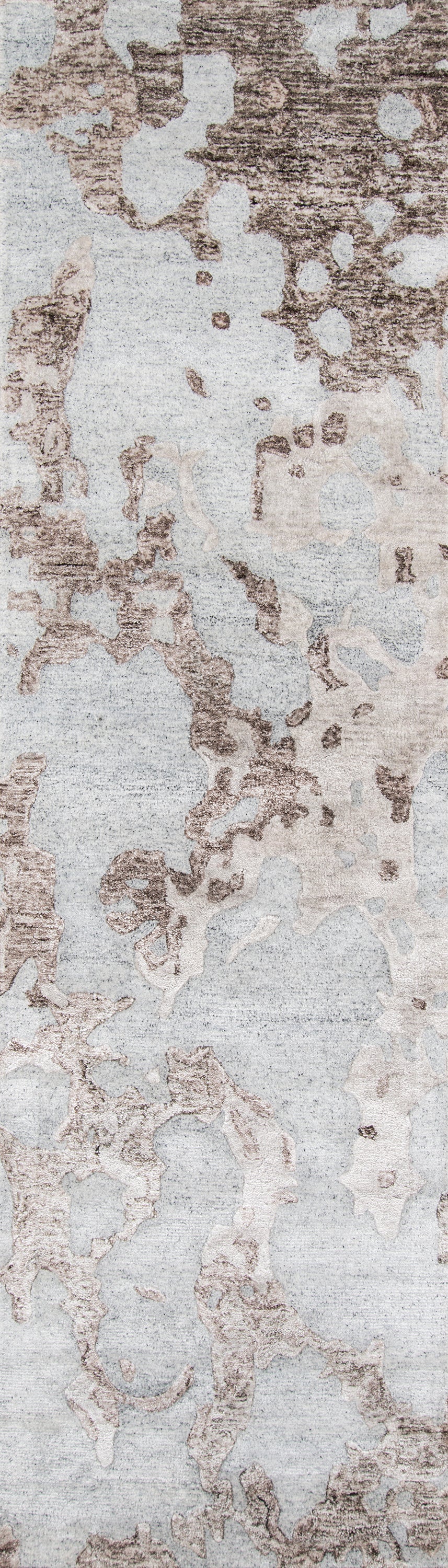 Abstract gray and taupe rug with mottled weathered pattern; soft, modern area rug.