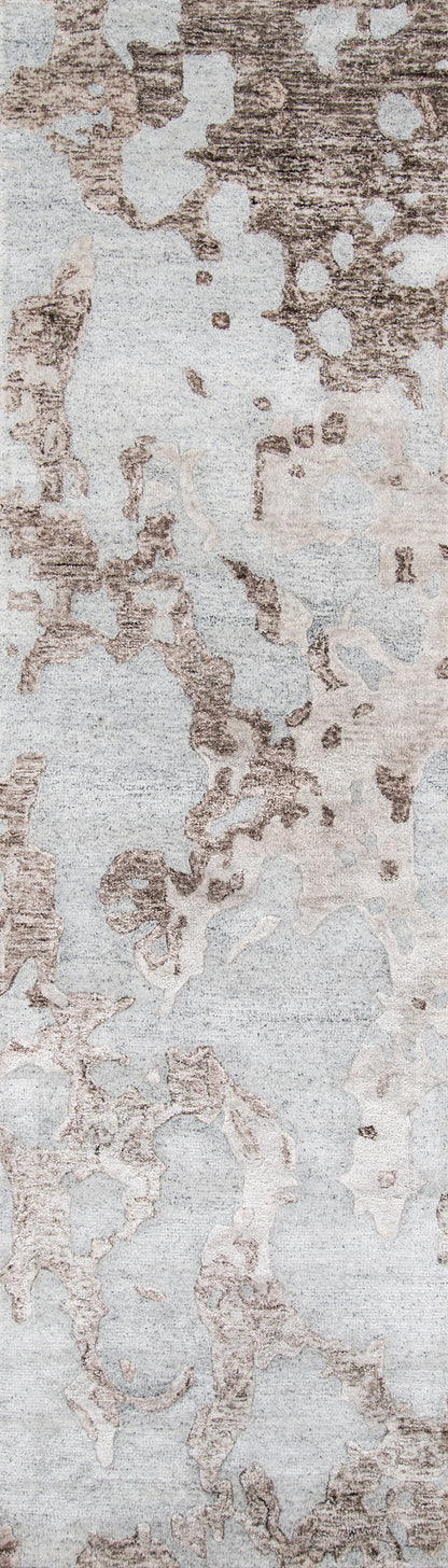 Abstract gray and taupe rug with mottled weathered pattern; soft, modern area rug.