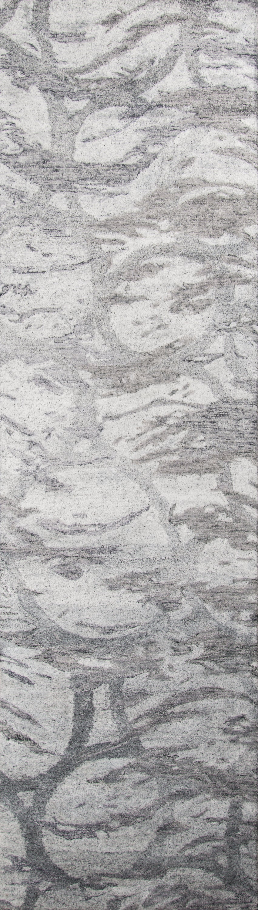 Textured grey and white rug with abstract stone-like pattern, soft low-pile, modern decor.