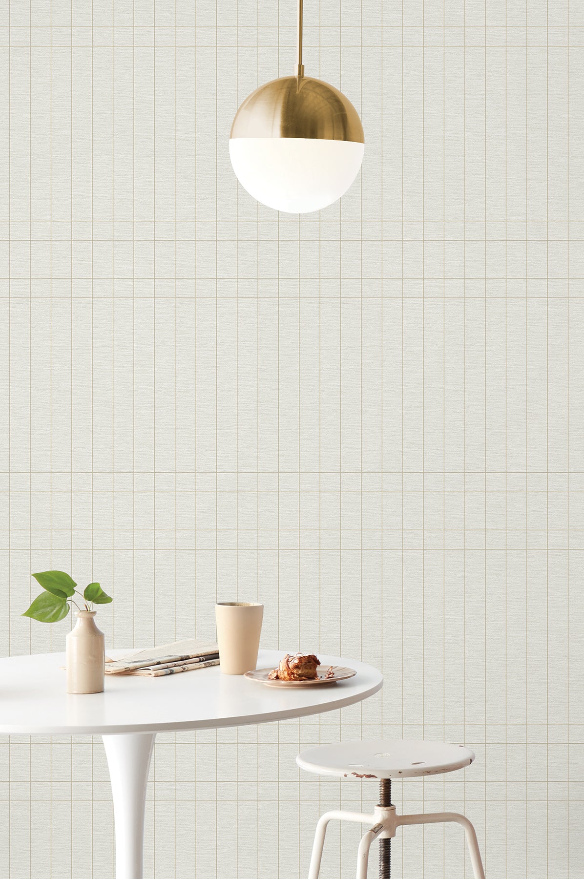 High-performance Magnolia Home Boulevard wallpaper MJ4847 in “Nesting” — cream background with metallic gold intersecting stripe tile pattern, durable vinyl wallcovering.