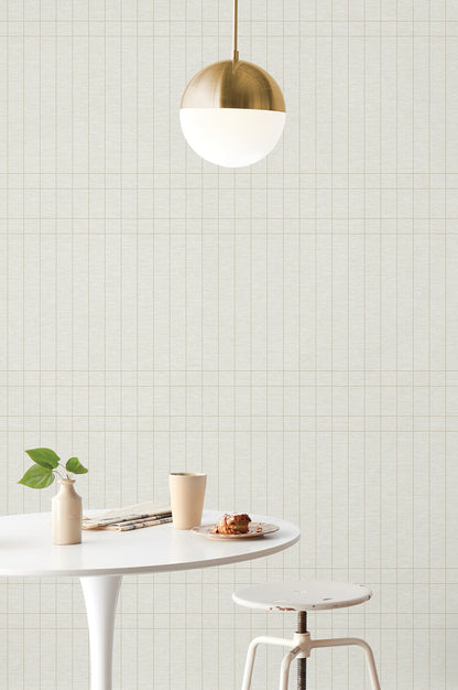 High-performance Magnolia Home Boulevard wallpaper MJ4847 in “Nesting” — cream background with metallic gold intersecting stripe tile pattern, durable vinyl wallcovering.