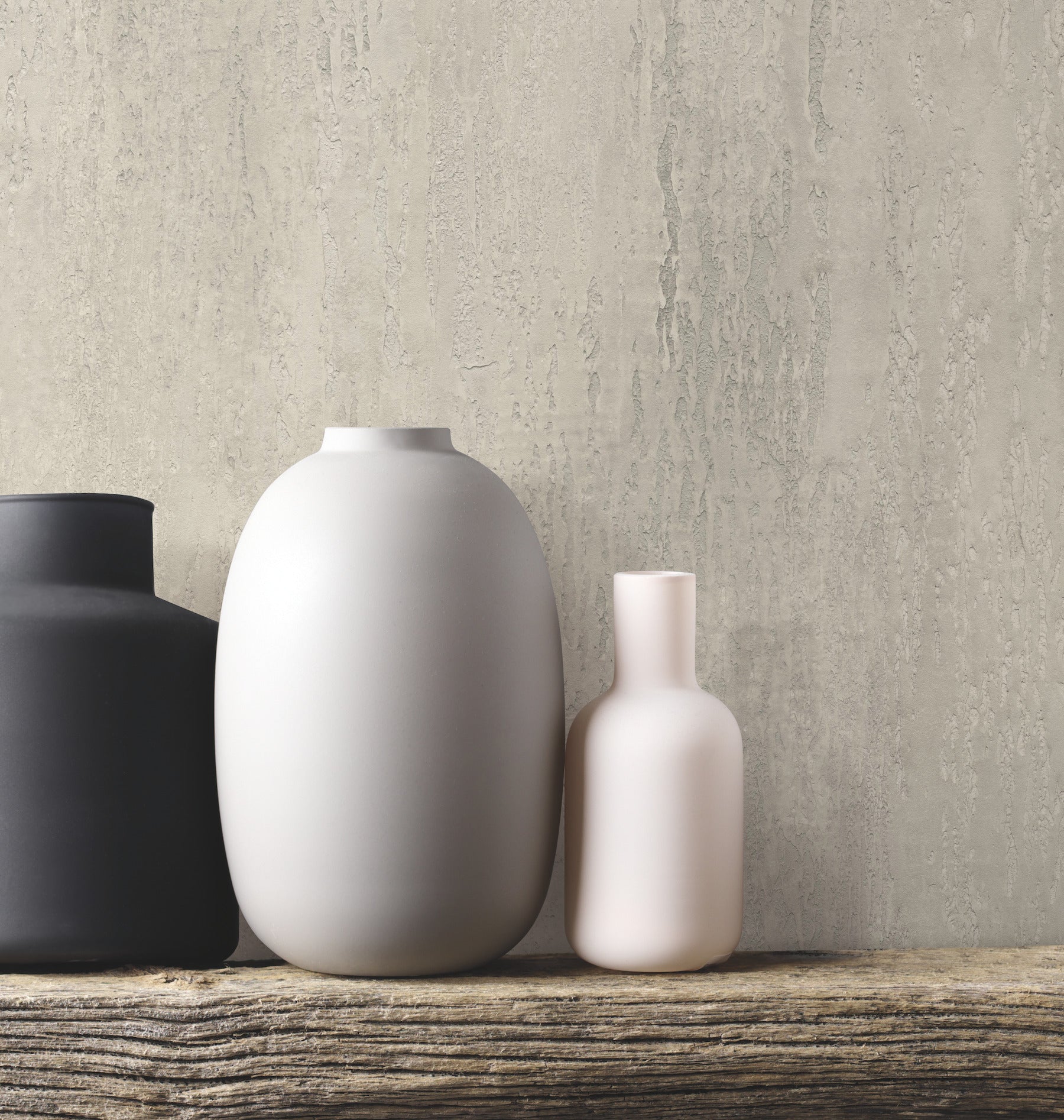 Warm grey stucco-style wallpaper with a subtle textured finish and architectural grey tones.
