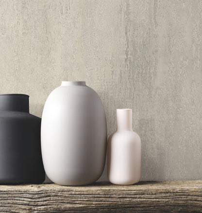 Warm grey stucco-style wallpaper with a subtle textured finish and architectural grey tones.